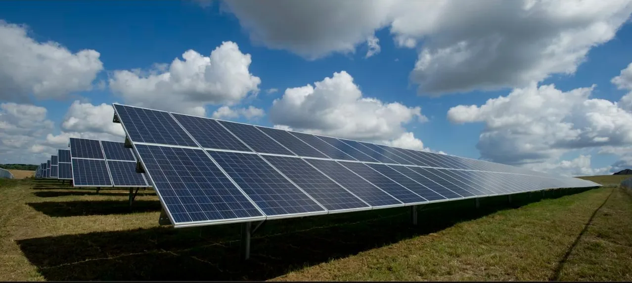 Ground-mounted solar panels under a clear blue Australian sky
